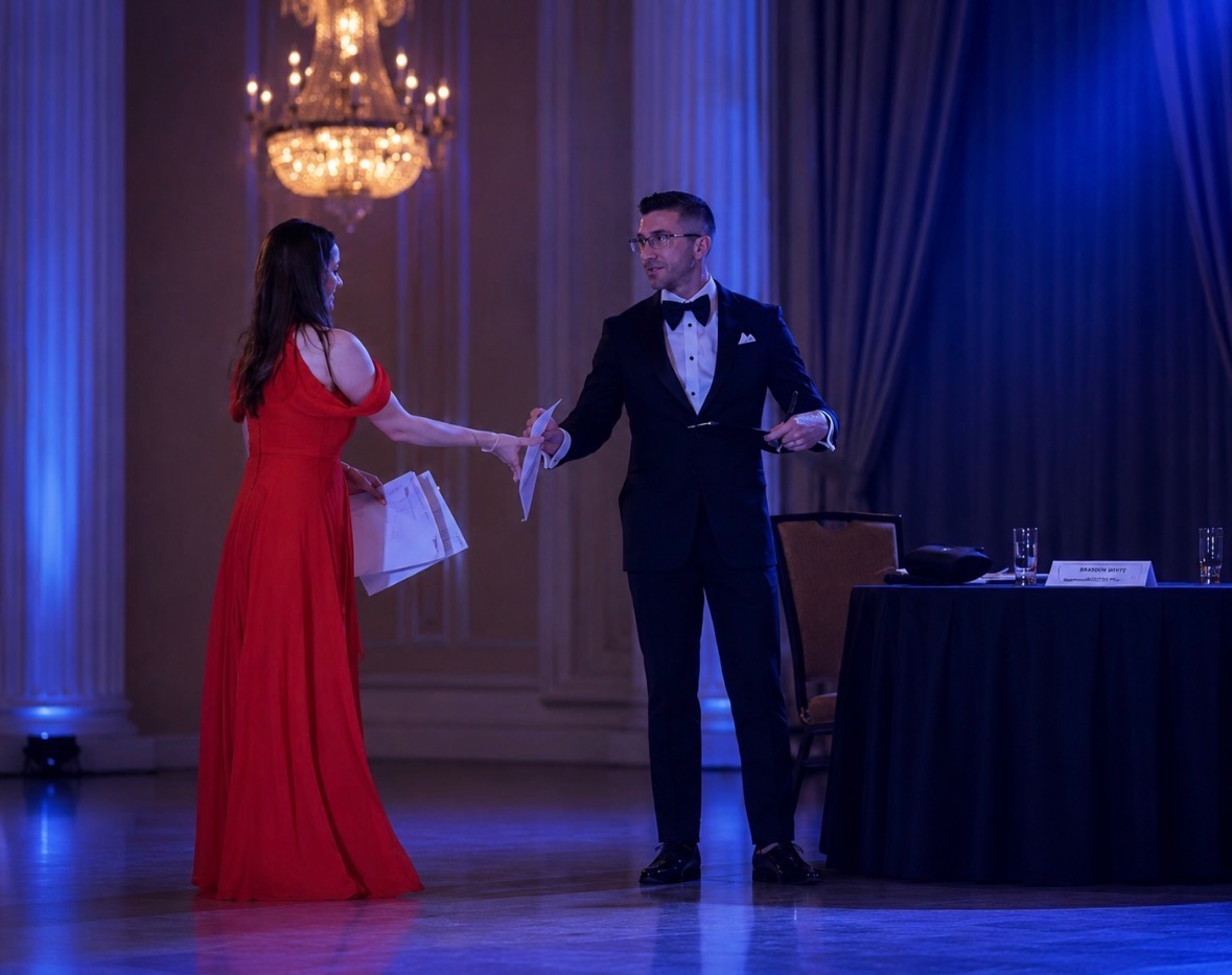 Adjudicator in tuxedo on the ballroom floor