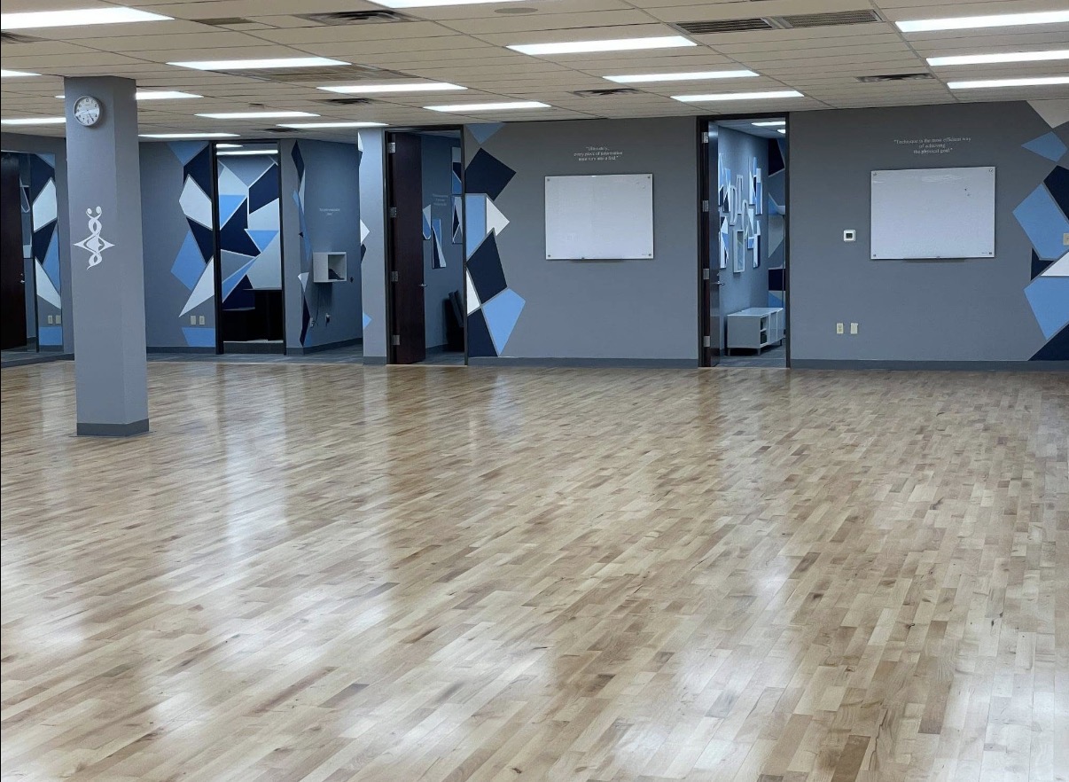 Ballroom with geometric murals and whiteboards